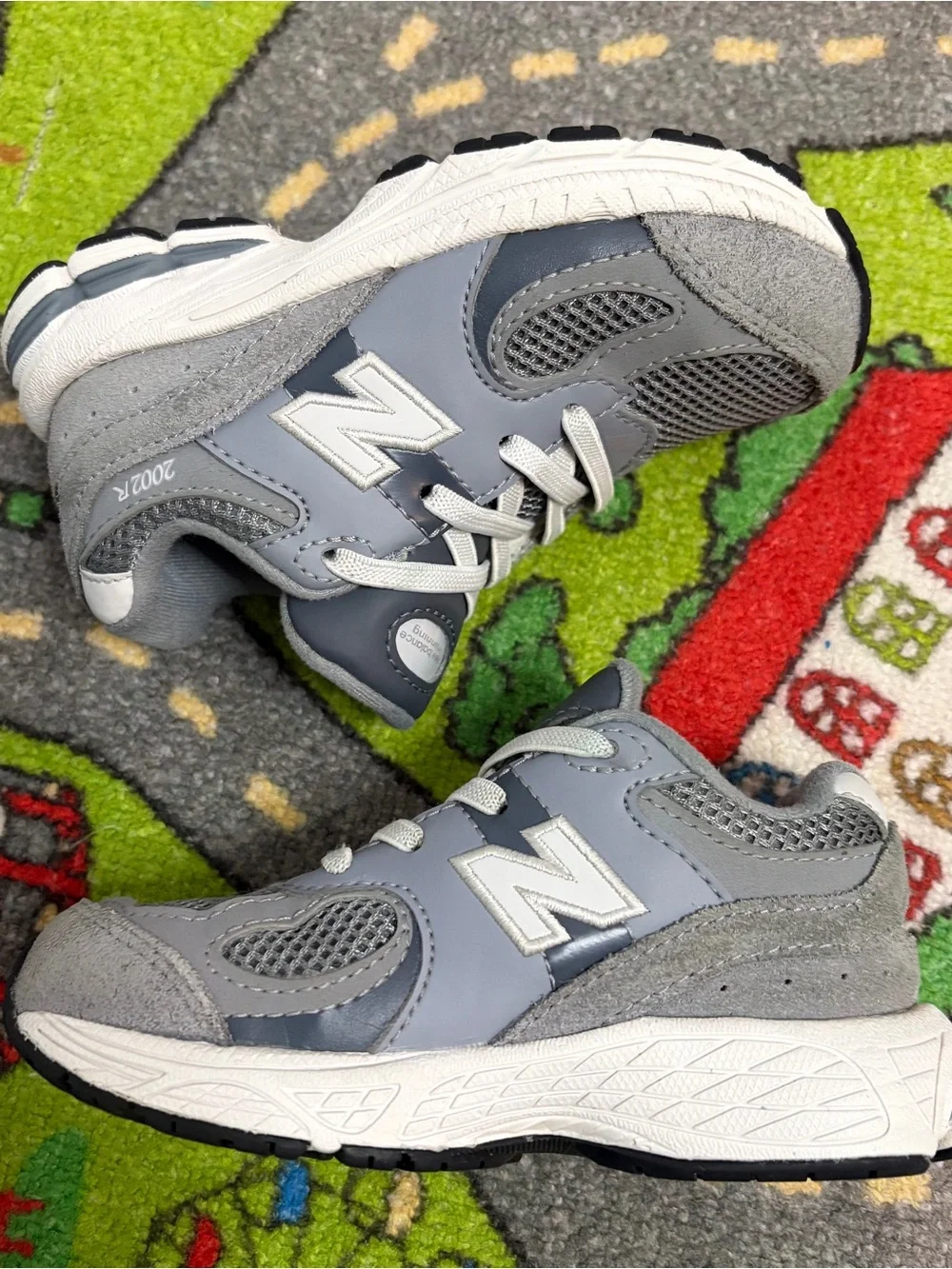 New Balance Kids Gray and White Sneakers